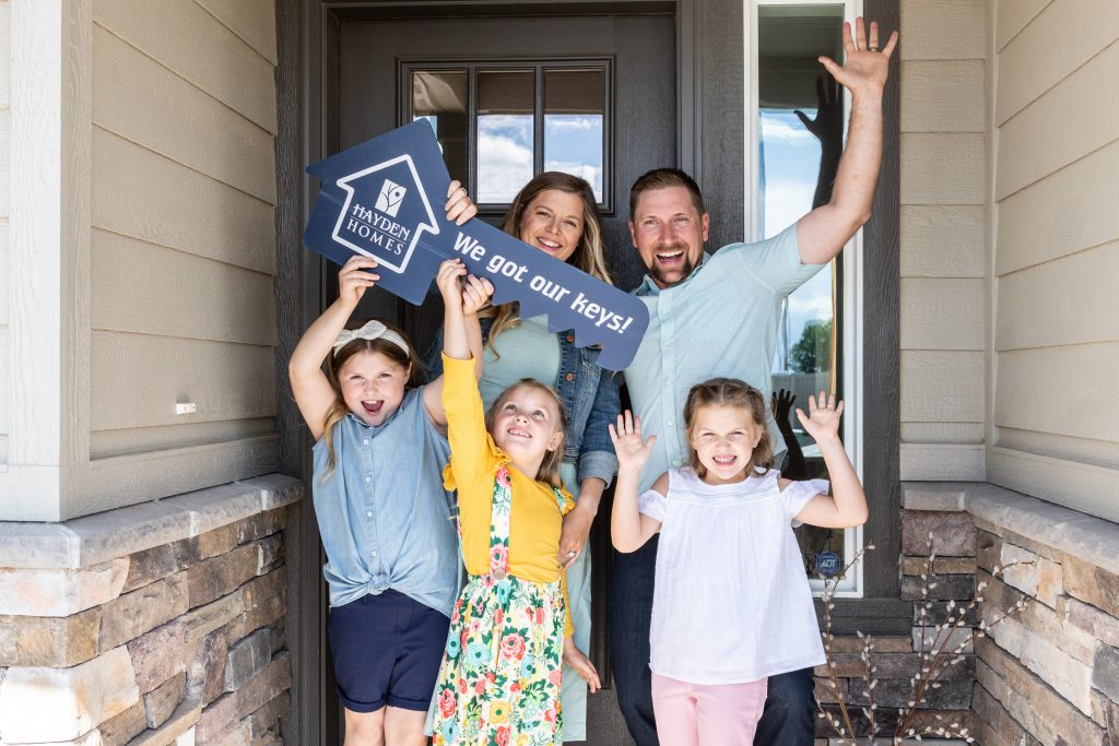 Homebuying Myths That Could Cost You - family celebrating new home